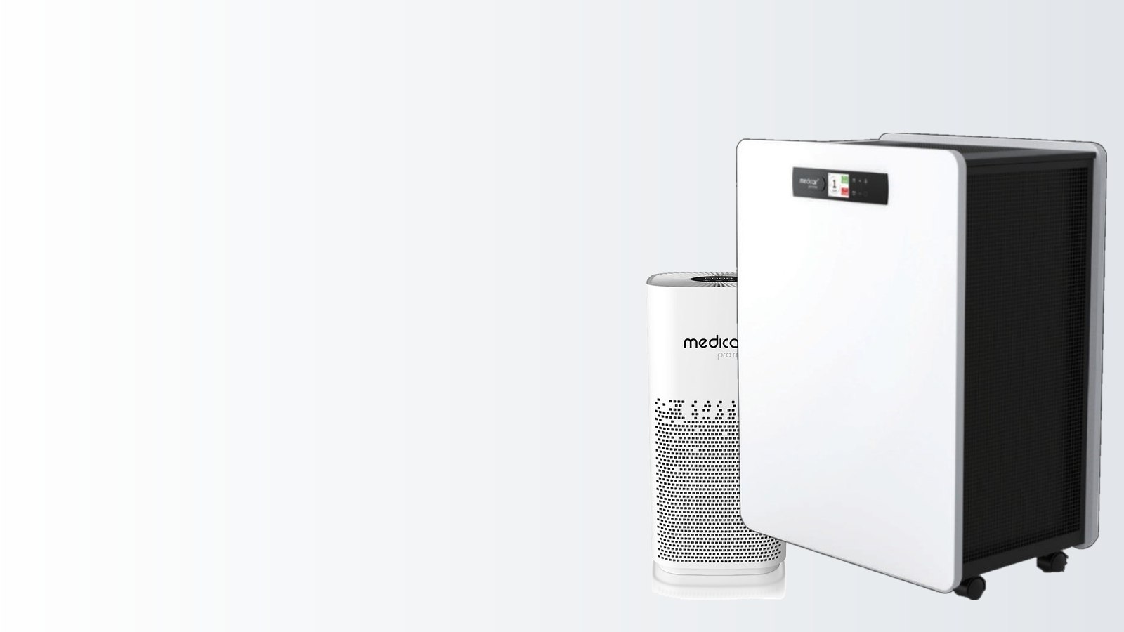 A compact MedicAir Pro Mini air purifier beside the larger wheeled MedicAir Pro Max, the two units most commonly specified for consultation rooms and waiting areas