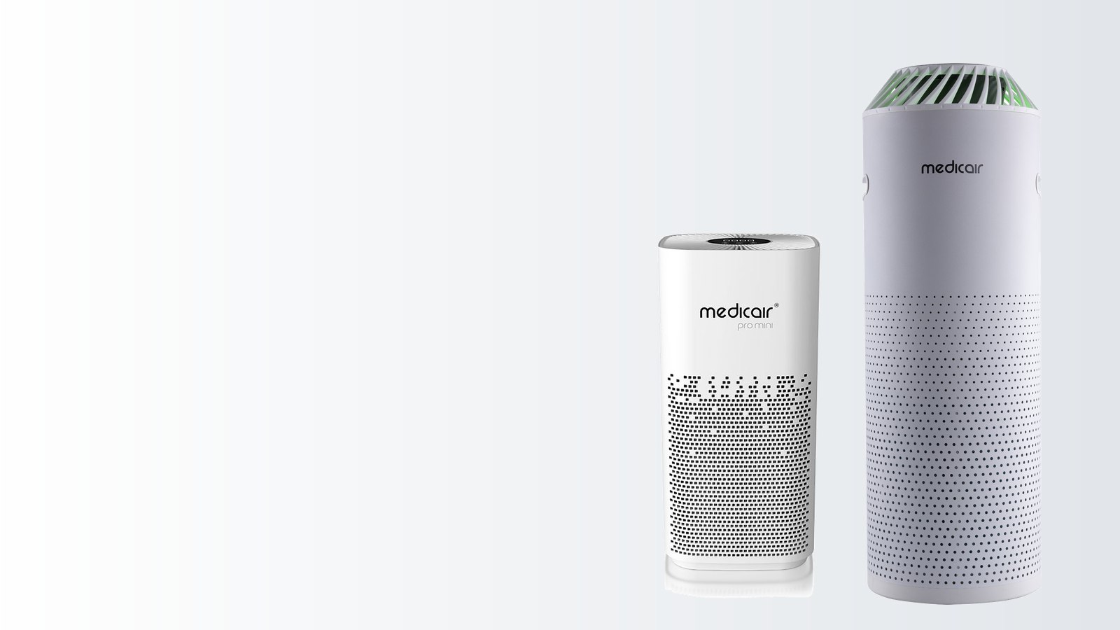 A compact MedicAir Pro Mini air purifier beside the taller cylindrical MedicAir Pro, shown at their relative heights on a plain background