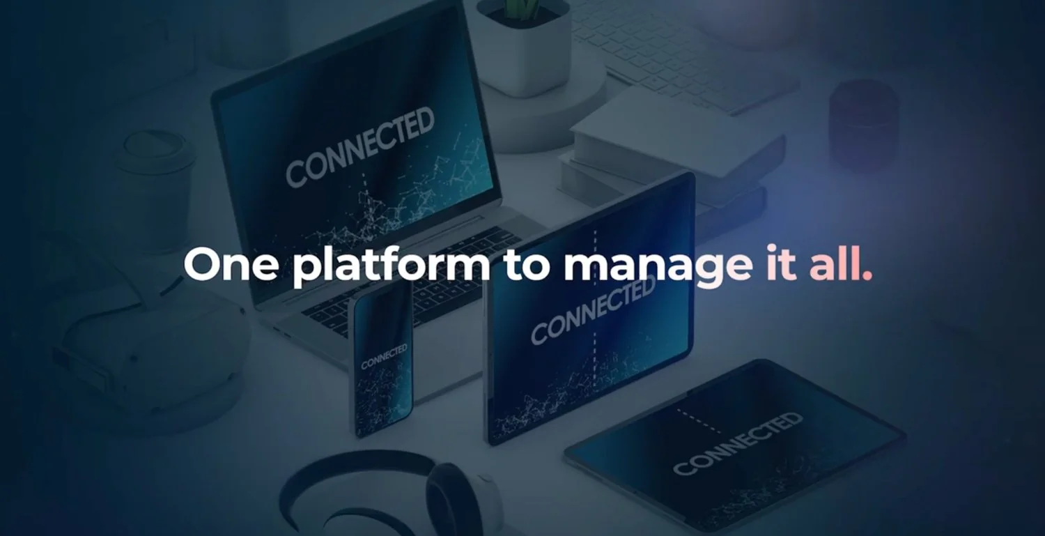 FileWave product image of a laptop, two tablets and a phone on a desk, with the line “One platform to manage it all”