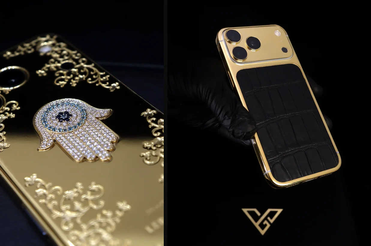 Two GoldPrivé iPhone 18 Pro Max editions on black. Left, a close-up of a gold back with raised gold filigree and a hamsa emblem set with clear and blue stones. Right, a gloved hand holding an iPhone with a polished gold frame and camera surround and a black crocodile leather back, with the gold GoldPrivé monogram below.