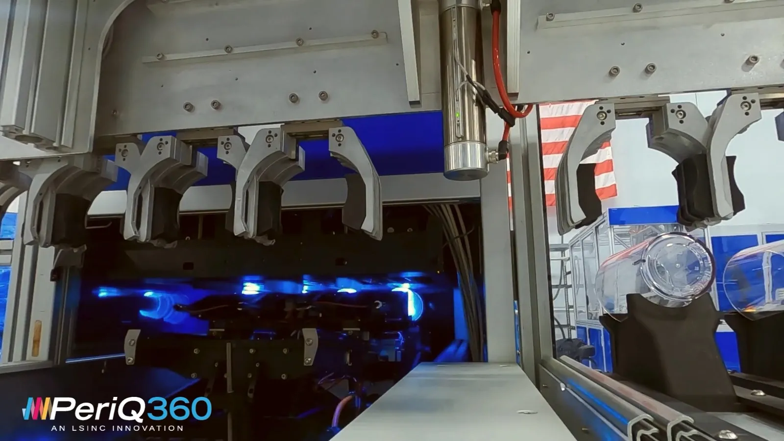 Four print tunnels of an LSINC PeriQ360 direct-to-object printer under blue LED curing light, each holding a container on its spindle
