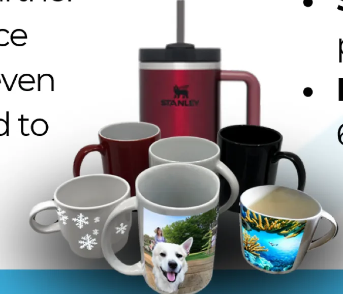 Printed ceramic mugs in white, red and black, one with a photograph, one with a winter scene and one with a tropical scene, beside a printed stainless steel tumbler