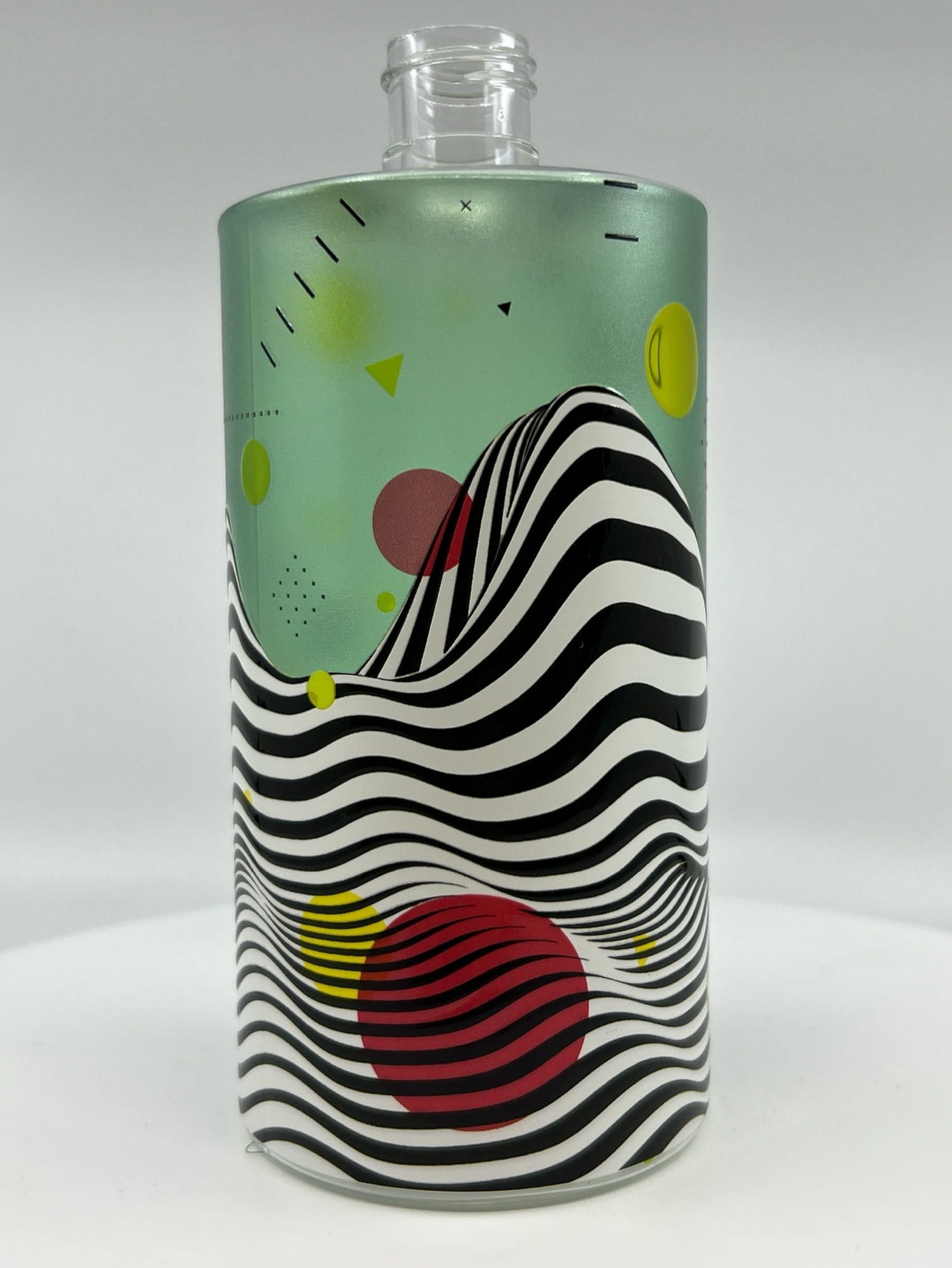 Beverage bottles moving through an LSINC printing system