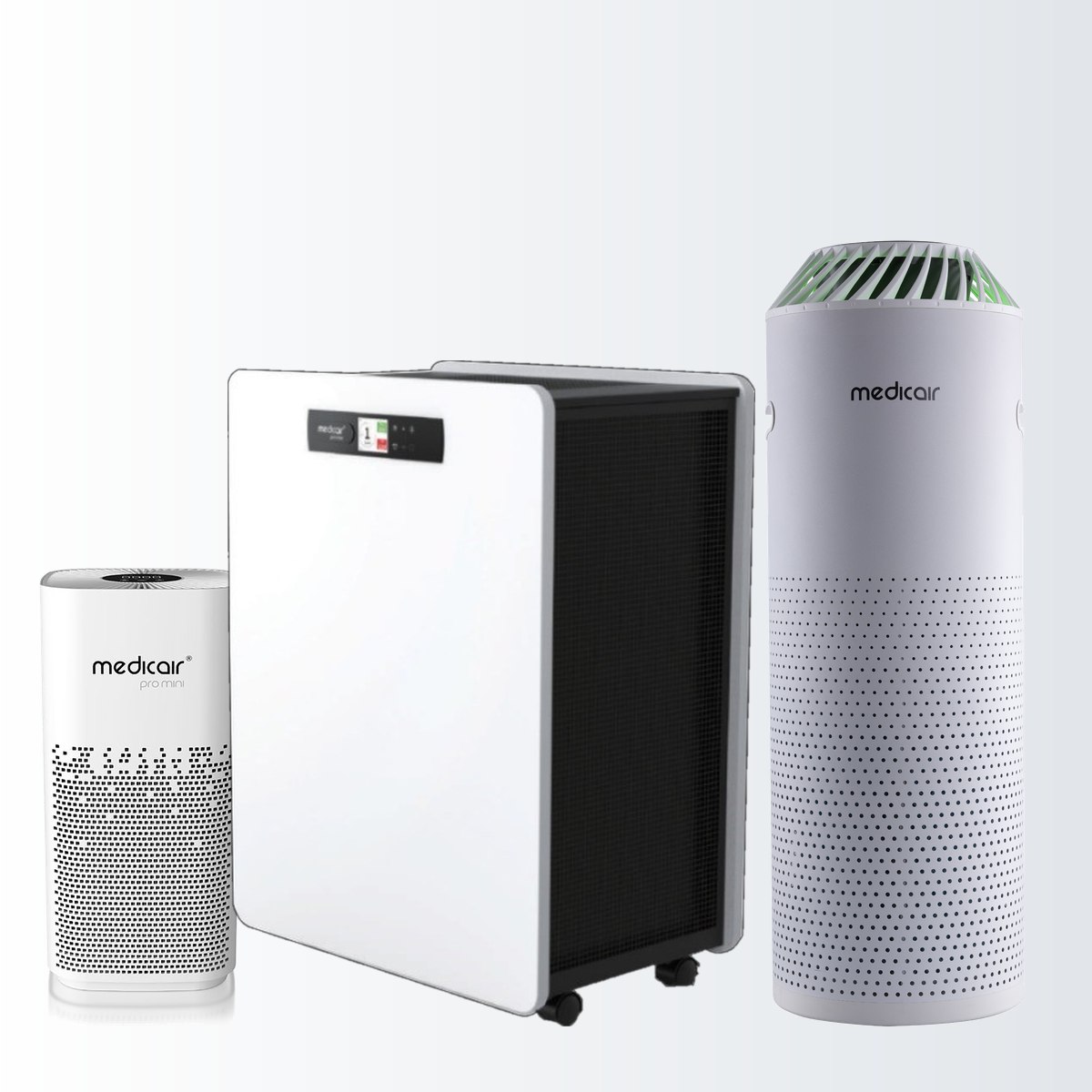 The three MedicAir air purifiers side by side: the compact Pro Mini on the left, the wheeled rectangular Pro Max in the centre and the tall cylindrical Pro on the right