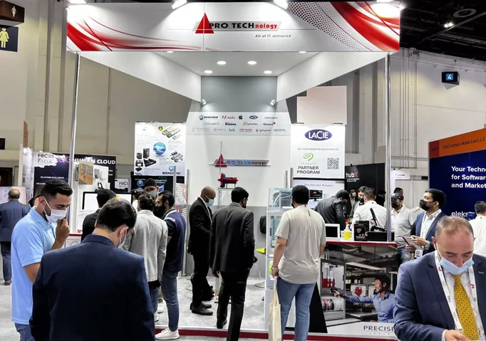 PRO TECHnology exhibition stand at GITEX Technology Week 2021 in Dubai with visitors and a Kanguru display panel on the back wall