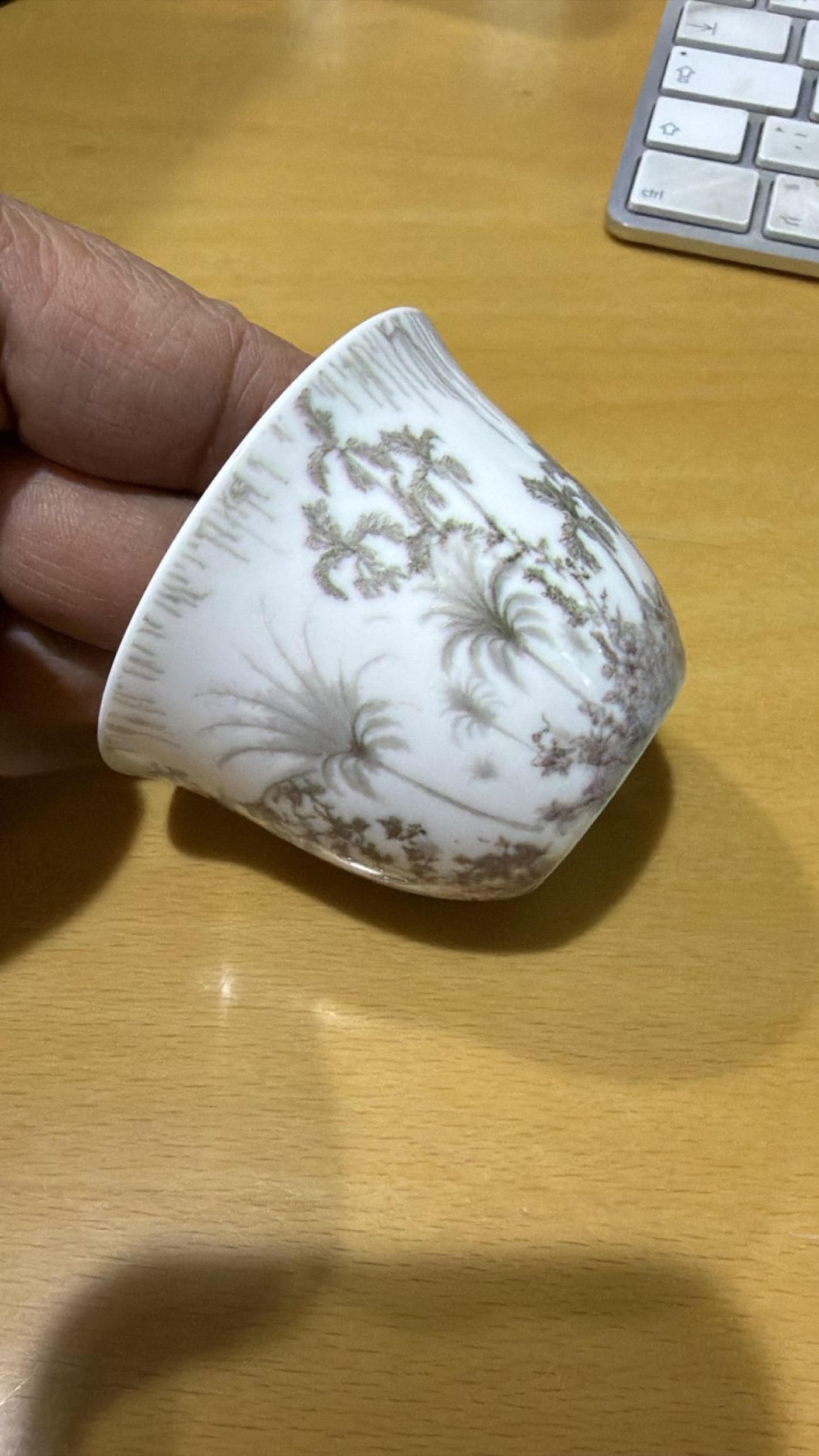 Printed qahwa cups arranged on a serving tray for hospitality