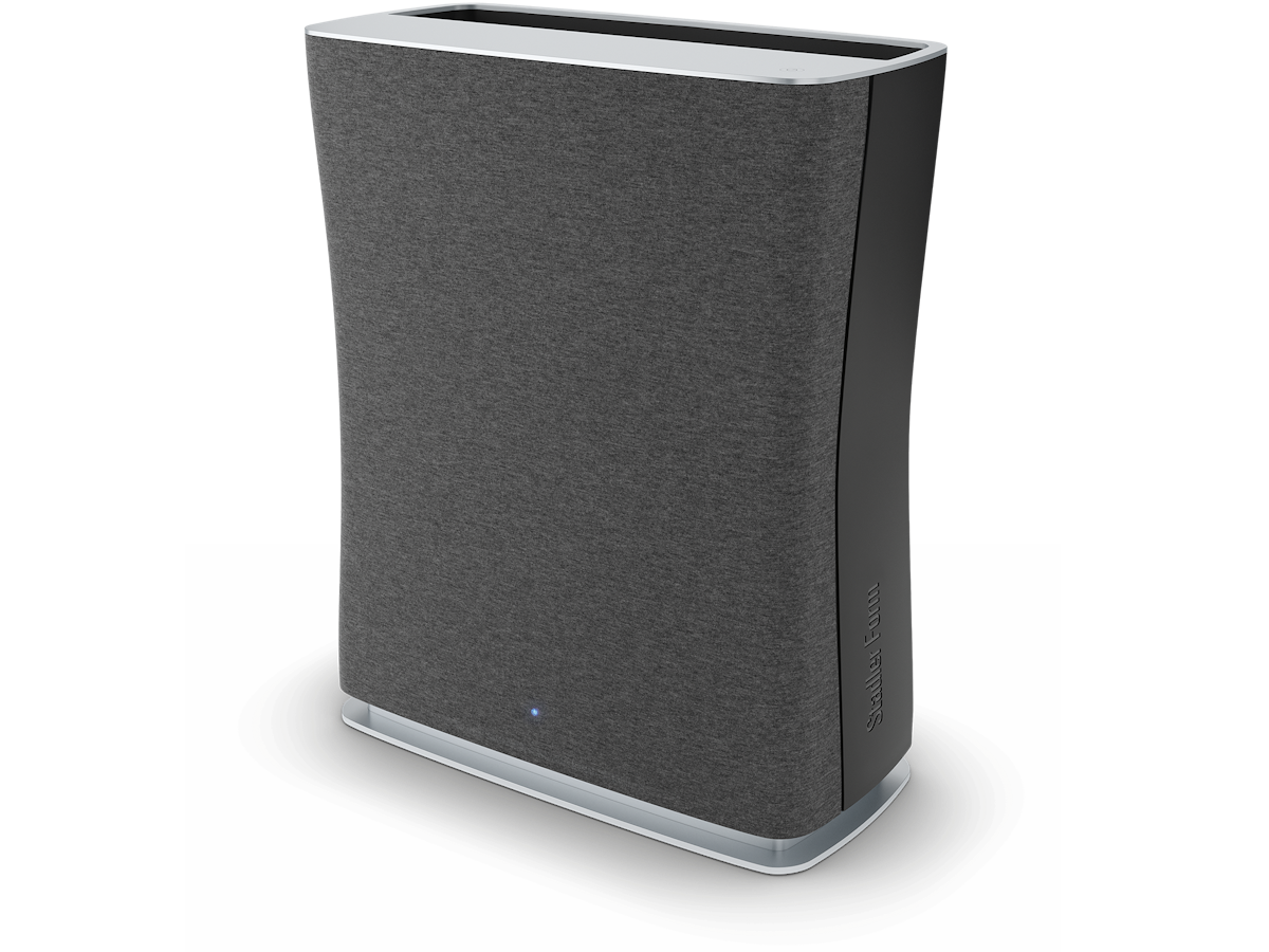 Stadler Form Roger air purifier standing beside a sofa in a Dubai apartment