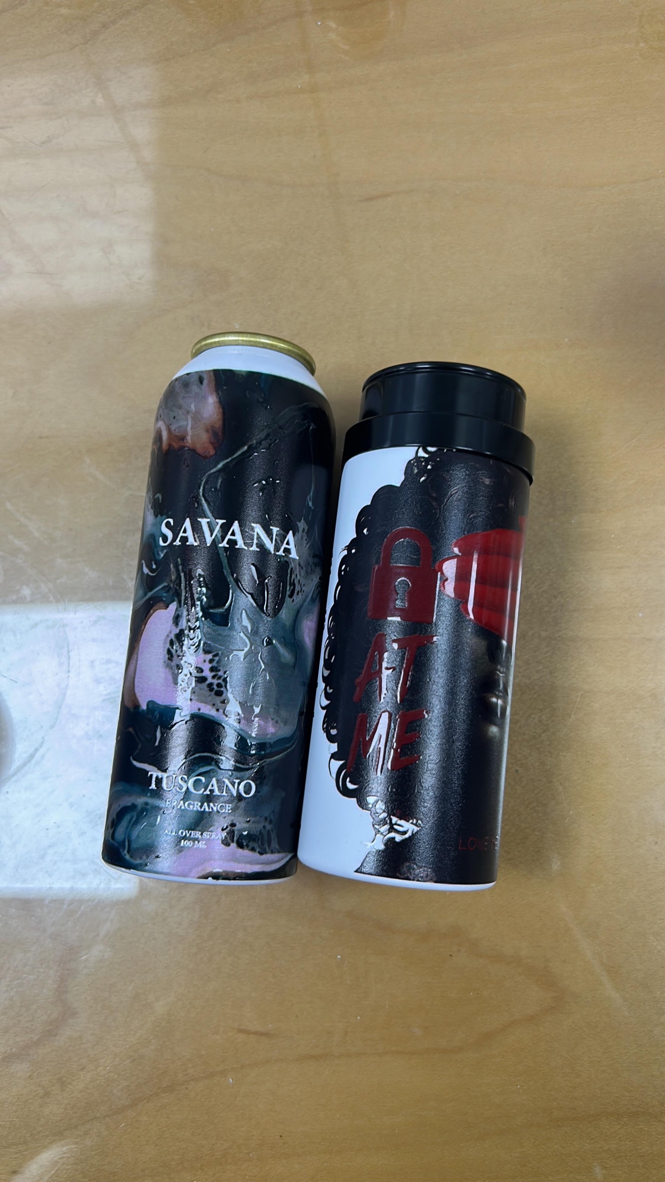 Body spray can with an embossed gloss printed finish