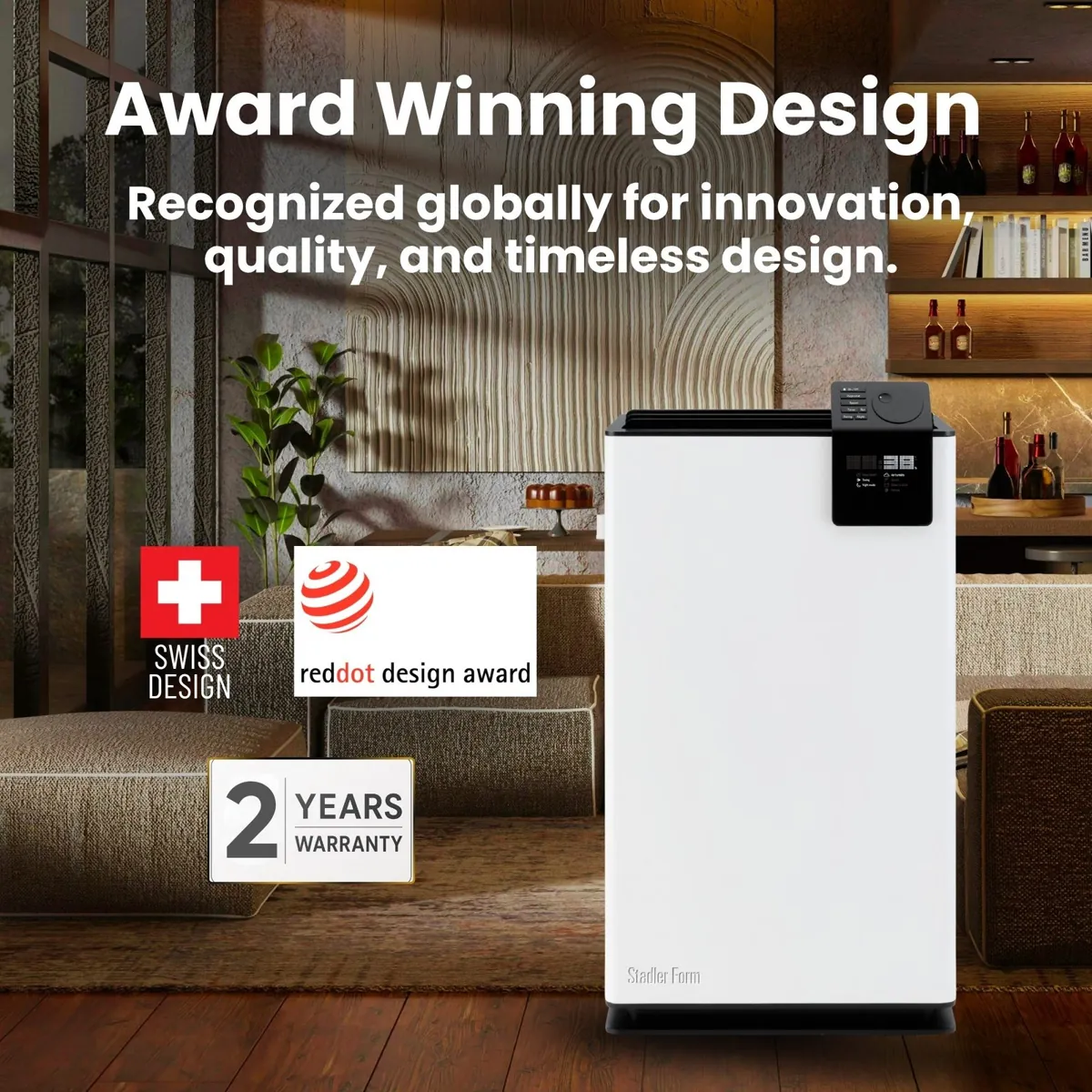 Stadler Form Albert dehumidifier in a lounge with Swiss design, red dot design award and 2 years warranty badges