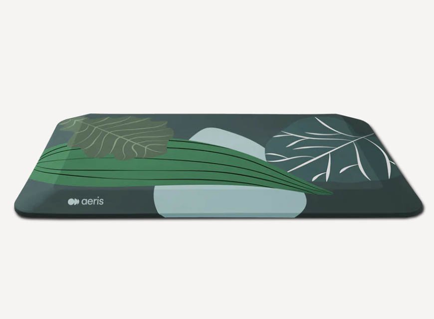 Aeris Muvmat anti-fatigue standing mat in dark green with leaf pattern