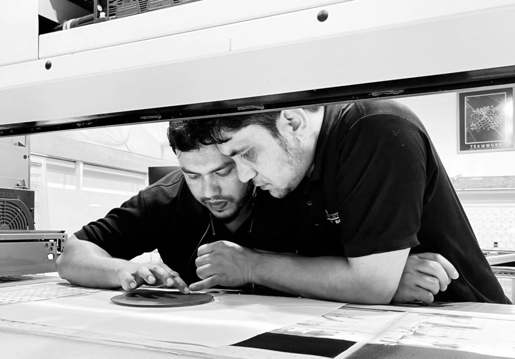 PRO TECHnology technicians checking a Marabu UV print on the flatbed, Dubai