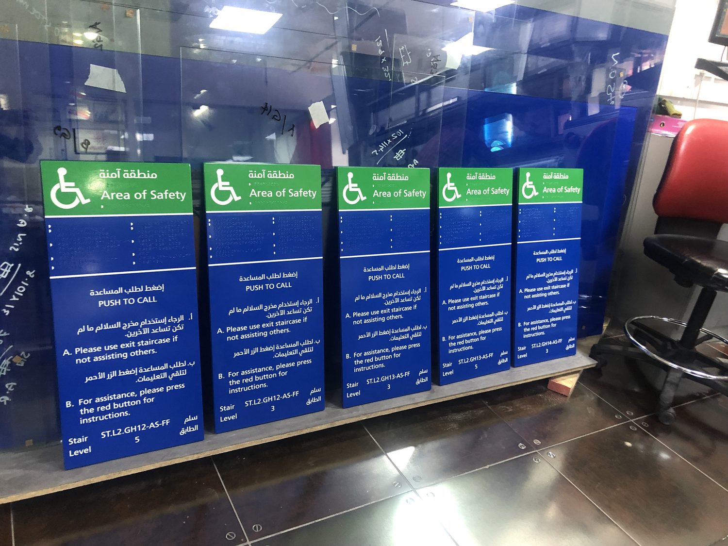 Bilingual Arabic and English safety signage with raised Braille, UV printed flat in Dubai