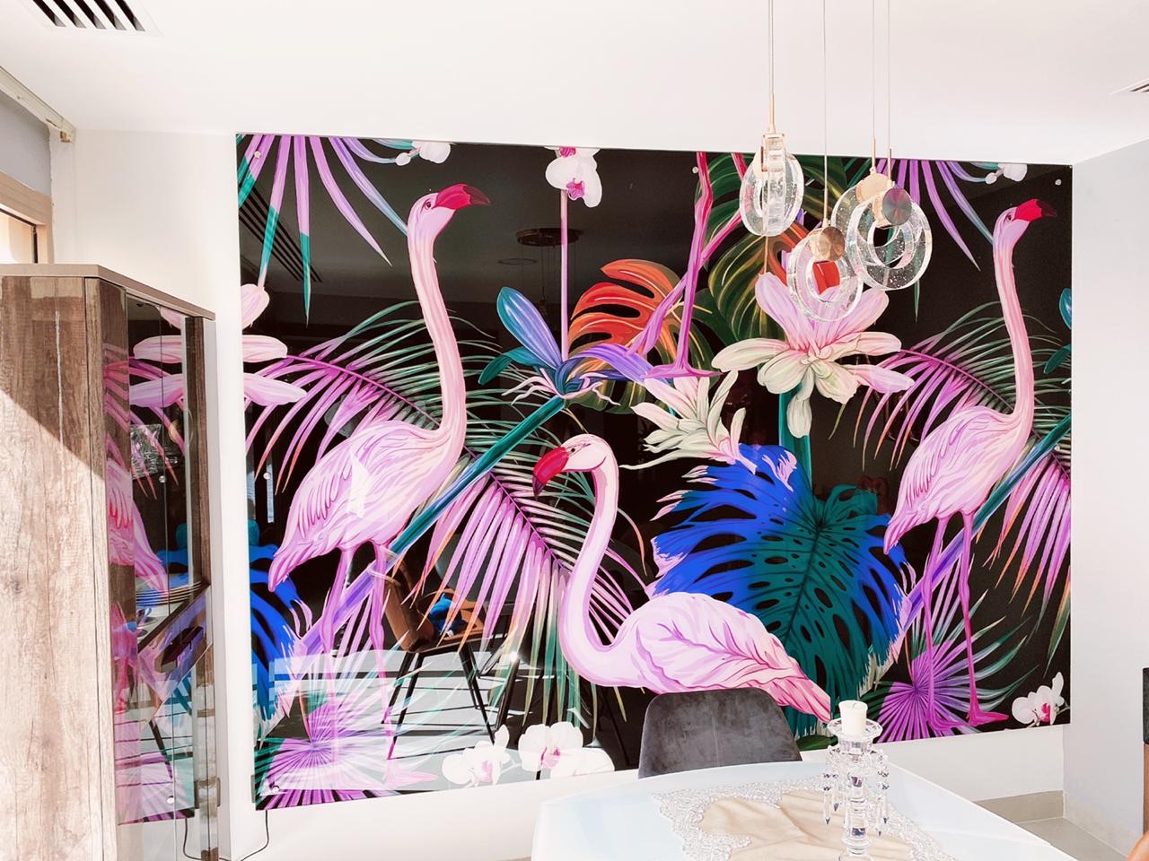 Large printed acrylic feature panel with a tropical flamingo artwork on a black ground, mounted on a dining room wall