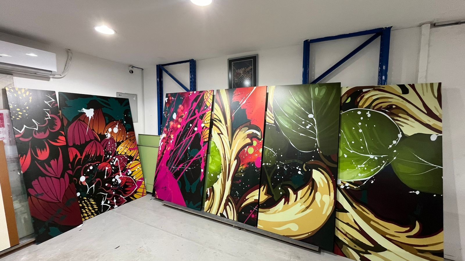 A botanical artwork UV-printed across a run of large ACP panels, standing in Sun Studio's Al Quoz studio in Dubai before installation